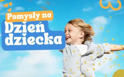 Radosny chłopiec z tekstem "Pomysły na Dzień Dziecka". Szukasz atrakcji dla dzieci w Małopolsce?
