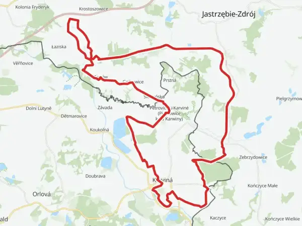 Mapa z zaznaczonym czerwonym szlakiem rowerowym, biegnącym przez tereny z nazwami miejscowości jak Karviná, Jastrzębie-Zdrój. To idealny żelazny szlak rowerowy.